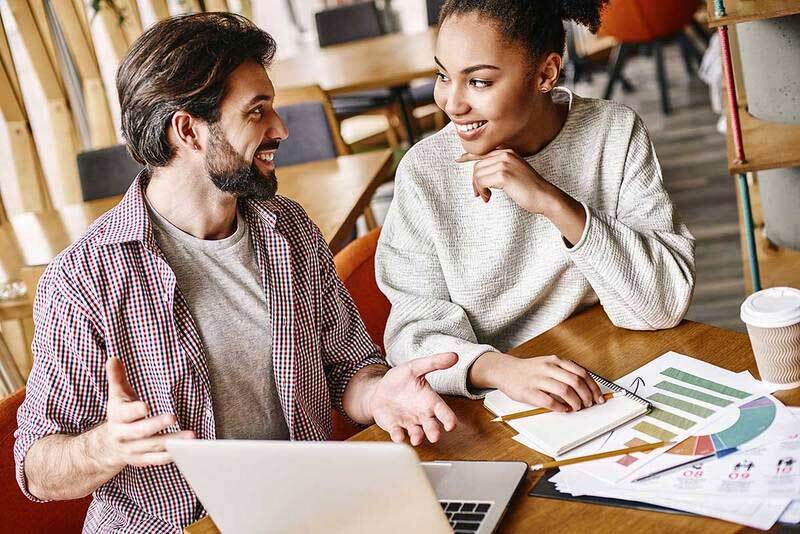 Man and woman smiling at each other