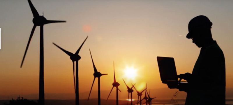 wind turbine technician working on enviormentally friendly job