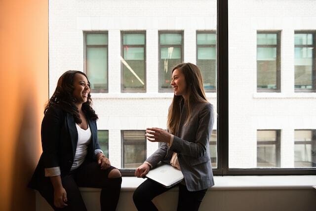 Women discussing job certification