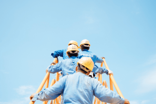 construction workers fearfully climbing heights.