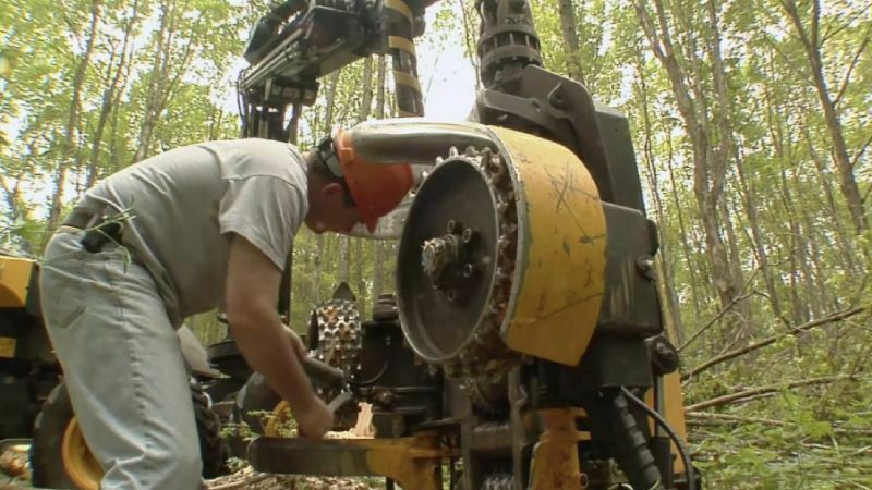 Mobile heavy equipment mechanic working on heavy equipment