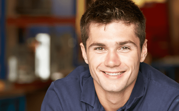 man smiles in a work shirt with no college degree career