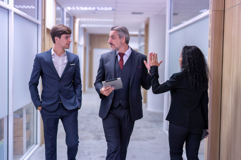 New employees in a work environment showing successful job shadowing experiences to build professional development and new skills